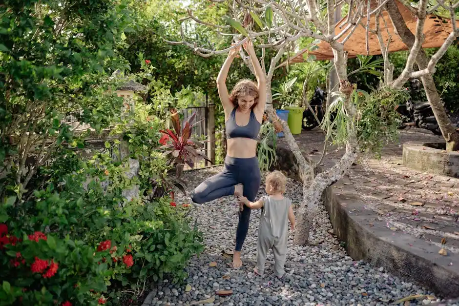 Woman practicing yoga with toddler in a lush garden, embracing nature and mindfulness.