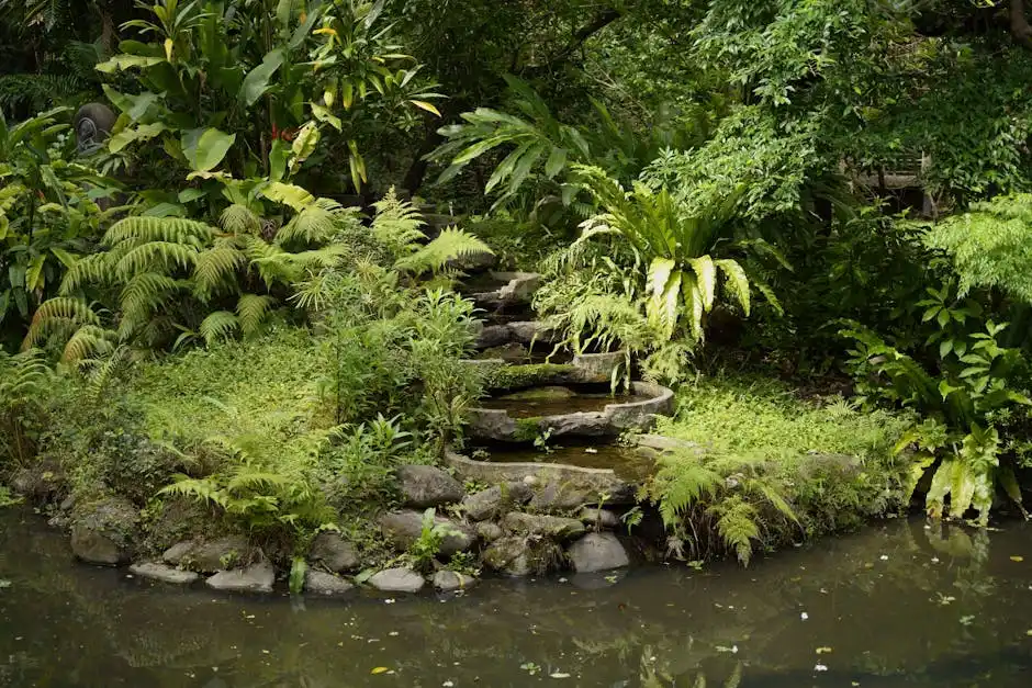 Serene view of a garden in Taipei with lush foliage and stone pathway by a pond.