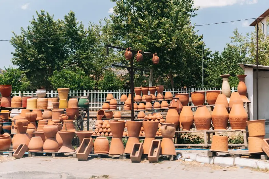 A collection of traditional clay pots displayed outdoors on a sunny day.