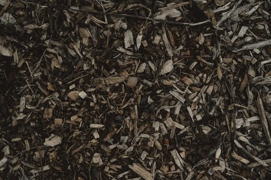 Detailed view of a natural wood chips texture, perfect for backgrounds or eco-themed designs.