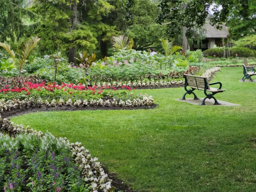 Beautiful garden with benches and vibrant flowers in a Toronto park during the day.