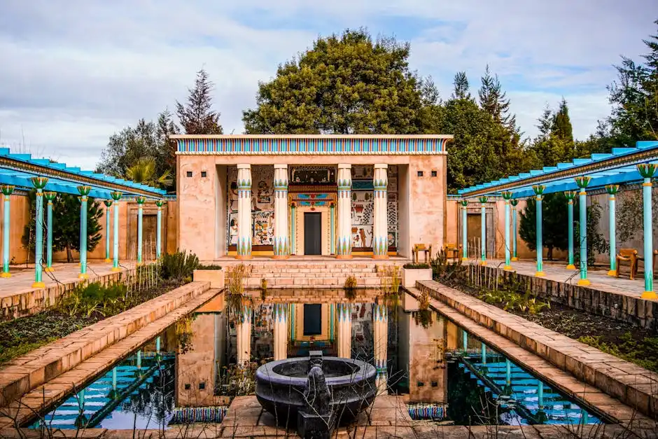 Explore a tranquil garden with classical architecture and serene reflections.