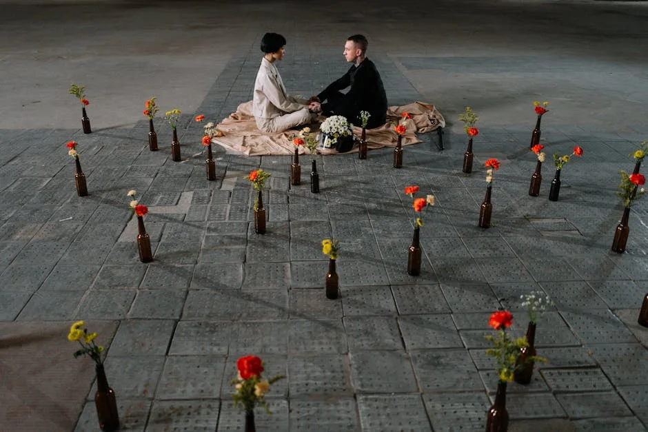 Couple seated in a floral arrangement, creating a serene and romantic atmosphere.