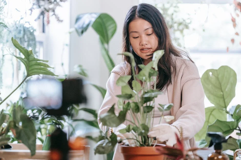 Asian woman nurturing plants indoors, surrounded by lush houseplants for indoor gardening.