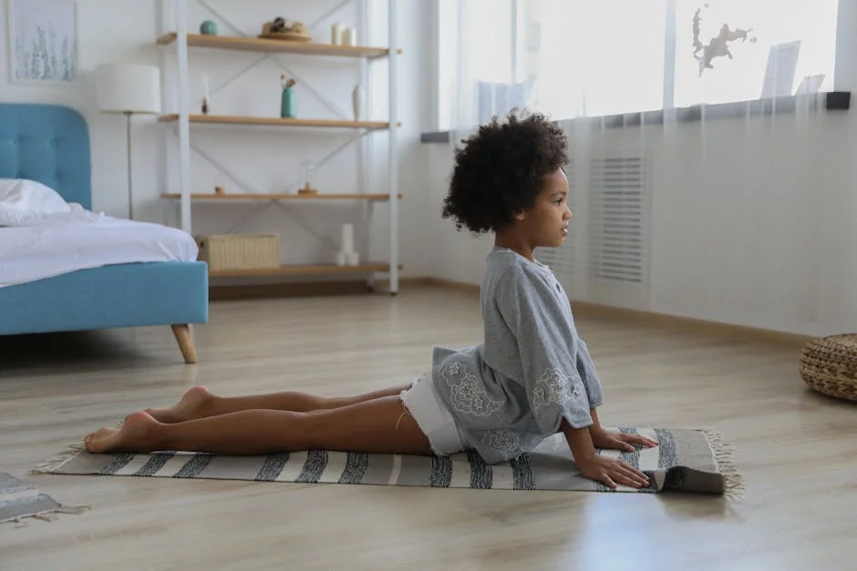 Child practicing yoga in a serene indoor setting, focusing on wellness and mindfulness.