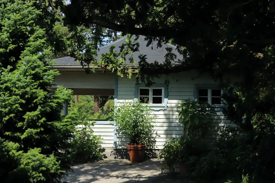 Charming wooden house surrounded by lush greenery in a serene forest atmosphere, perfect summer retreat.