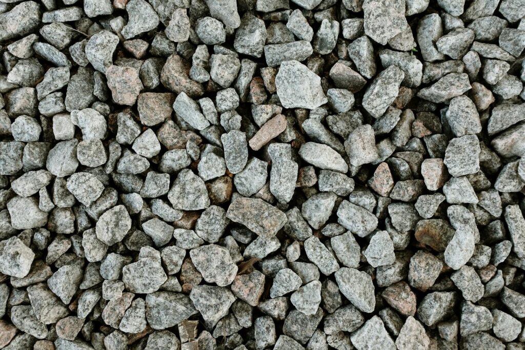 Granite gravel stones viewed from above, showcasing a detailed natural texture.
