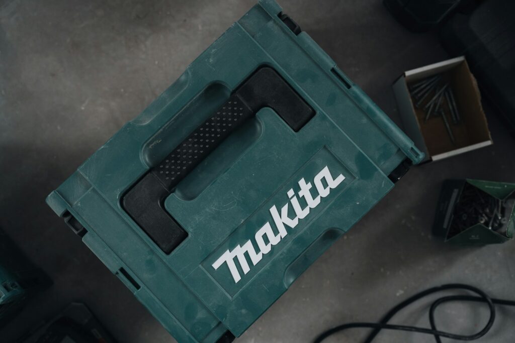 A makita container sits on a surface.