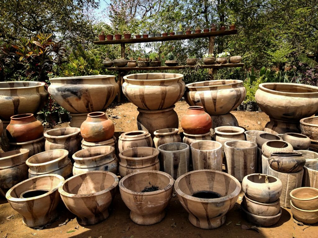 brown clay pots on brown soil