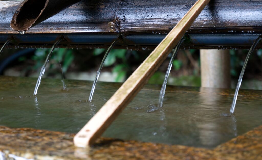 a close up of water running from a pipe