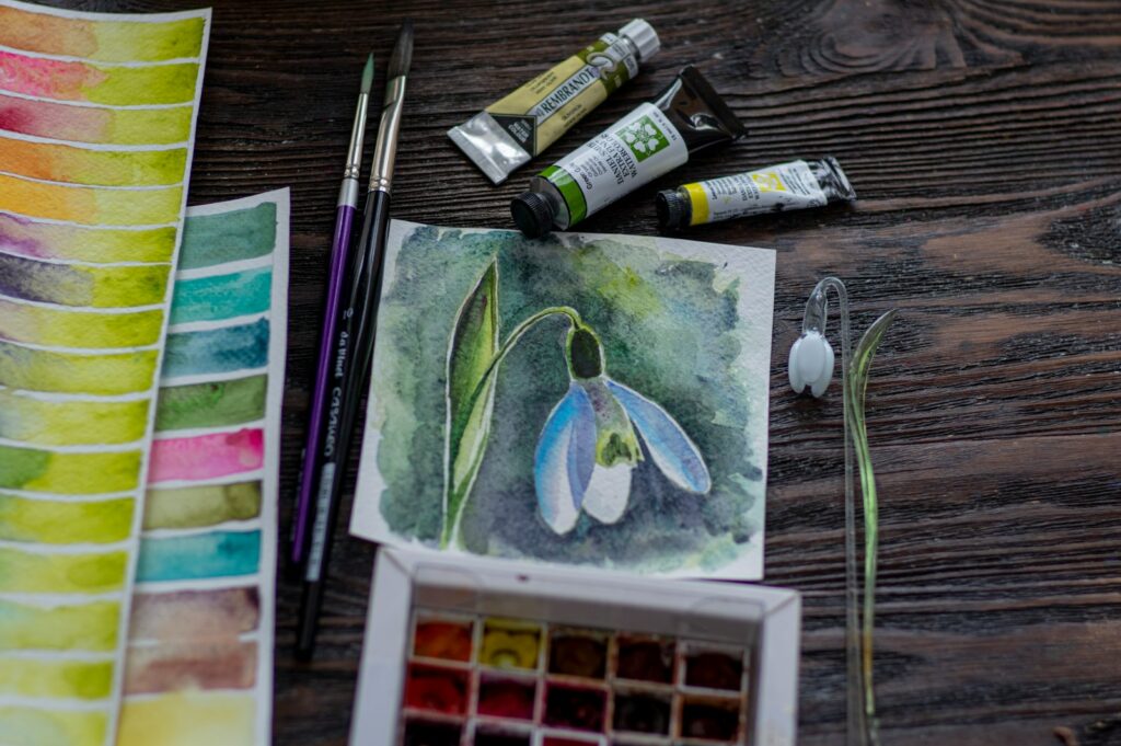 white and green floral ceramic plate on brown wooden table