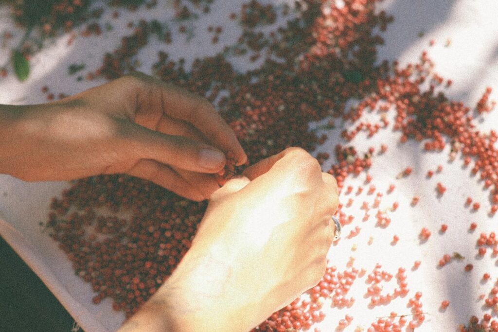 persons hand on black and white textile