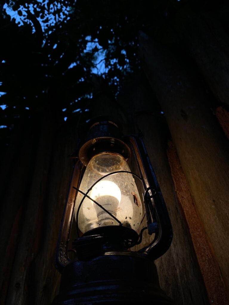 a lantern is lit up in the dark