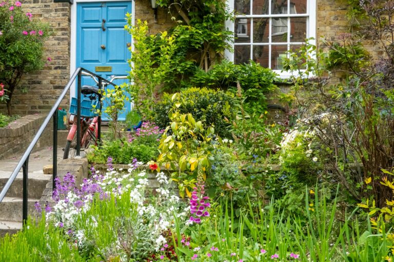 a bicycle is parked in front of a blue door