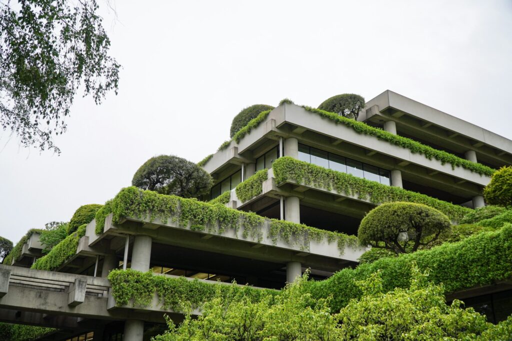 a building with a lot of plants growing on it