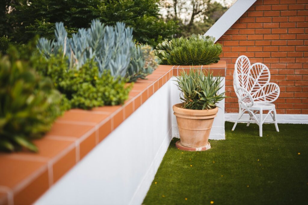 a chair and potted plants on a patio