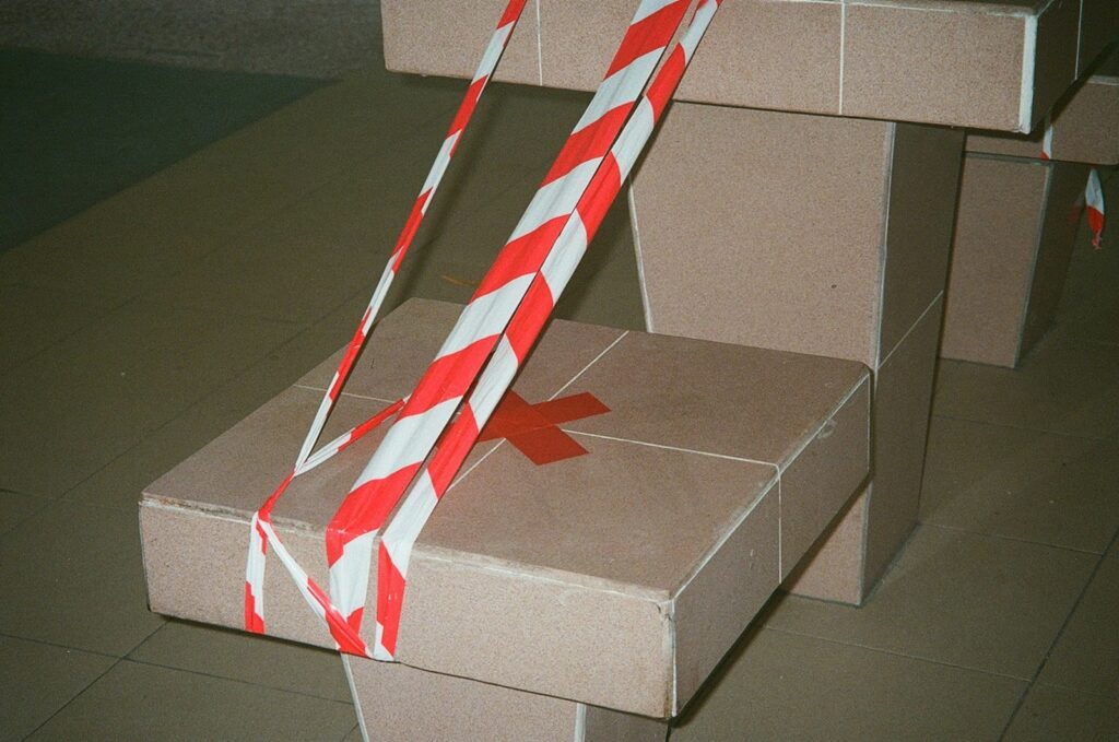 A box with a candy cane sticking out of it