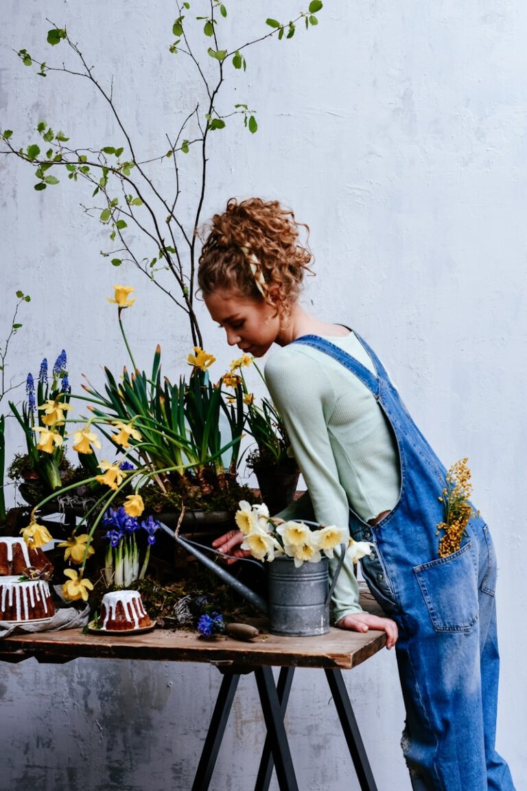 Woman watering plants with daffodils and small cakes