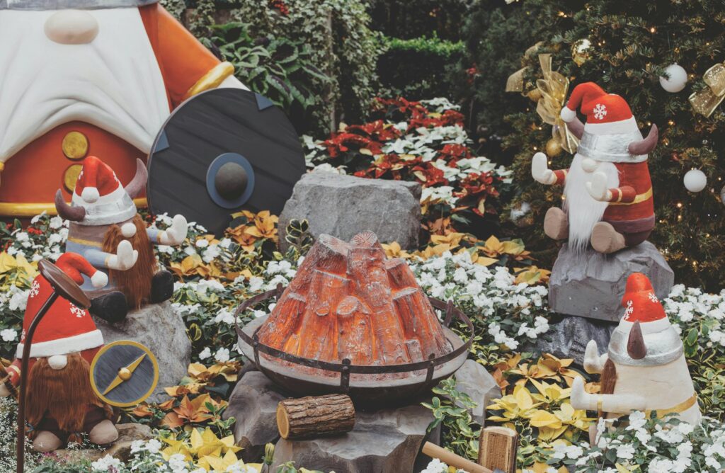 a group of gnome figurines in a garden
