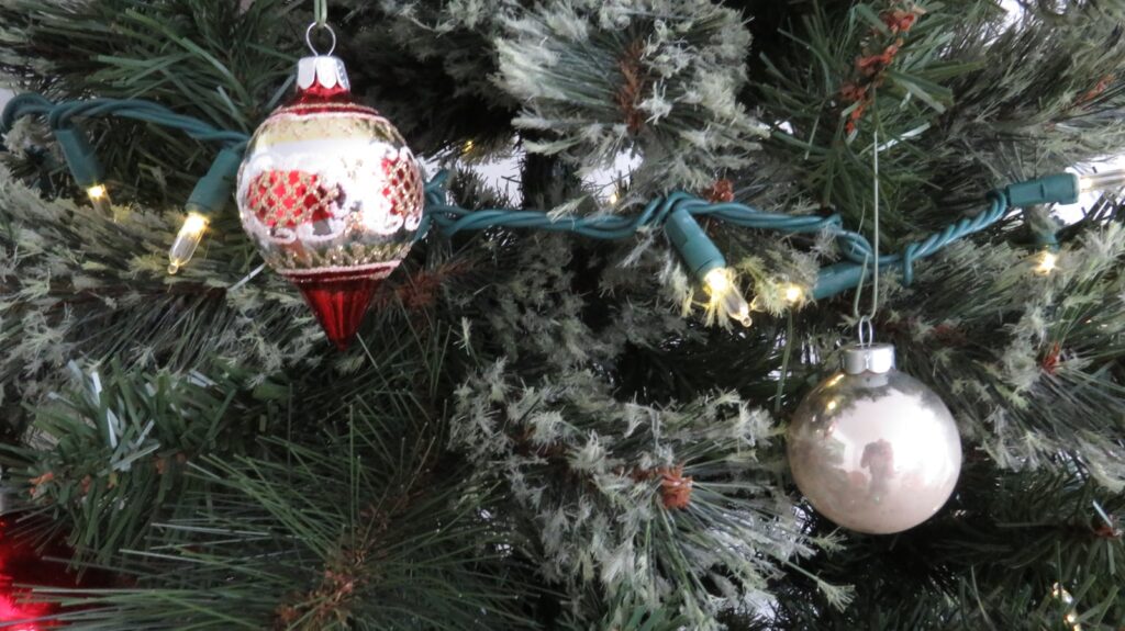 A close up of a christmas tree with ornaments