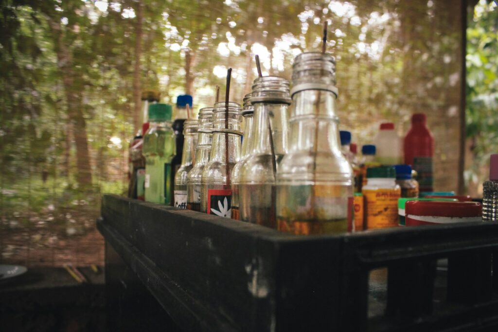 assorted-brand glass bottles on crate
