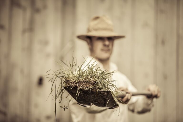 gardener holding a shovel in the 50s