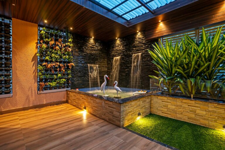Elegant indoor garden with waterfalls and plants, creating a relaxing oasis in Mumbai, India.