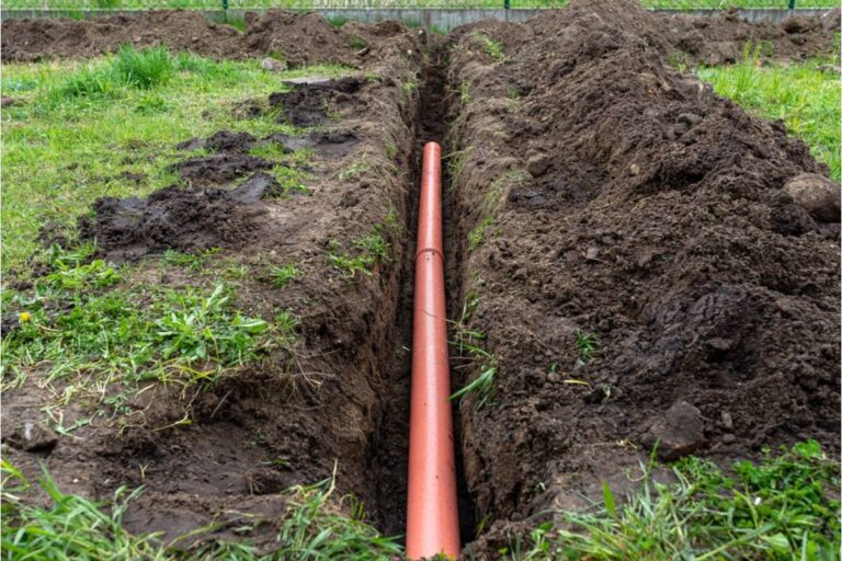 Homeowner Says Her Neighbor's New Above-Ground Septic Vent Pipe Was Installed Right Next to Her Vegetable Garden, Now She's Questioning Whether It's Even Safe