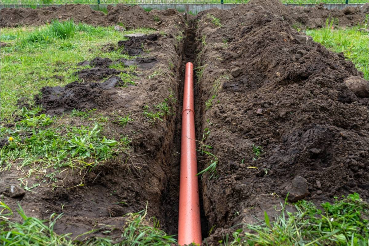 Homeowner Says Her Neighbor's New Above-Ground Septic Vent Pipe Was Installed Right Next to Her Vegetable Garden, Now She's Questioning Whether It's Even Safe