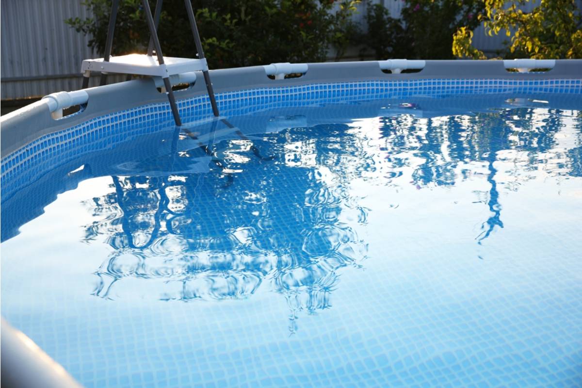 Homeowner Says His Neighbor's New Above-Ground Pool Deck Was Built So Close to the Fence That Runoff Chemicals Now Drain Into His Garden