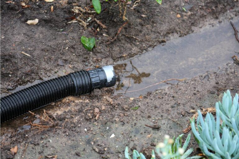 Homeowner Says His Neighbor Has Been Redirecting Downspout Water Into His Raised Beds for Two Winters, Now the Wood Is Rotting From the Inside