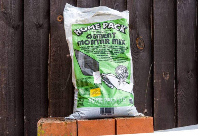 Homeowner Says His Neighbor's Renovation Crew Has Been Storing Wet Cement Bags Against His Garden Fence for Weeks, Now the Runoff Has Killed Everything Along That Border