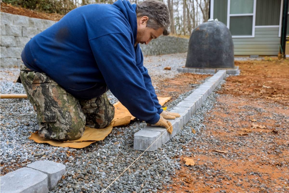 Homeowner Says His Neighbor Has Been Quietly Widening Her Driveway Onto His Property Line Every Time She Repaves It, Now a Survey Shows She's Taken Nearly Three Feet of His Front Garden