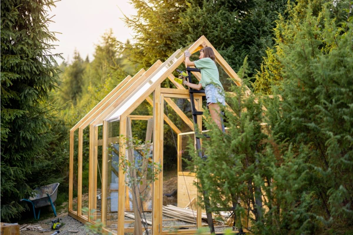 Homeowner Says His Neighbor Watched Him Struggle to Carry a New Greenhouse Frame Alone for an Hour, Then Asked if She Could Use It to Store Her Holiday Decorations Once It Was Built
