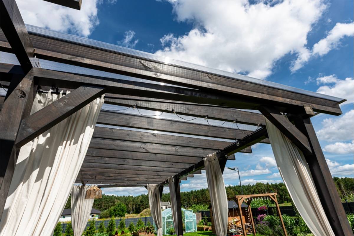 Homeowner Says His Neighbor Insisted His Garden Pergola Was Casting Unfair Shade on Her Solar Panels, Then Built an Identical Pergola on Her Own Patio the Following Spring
