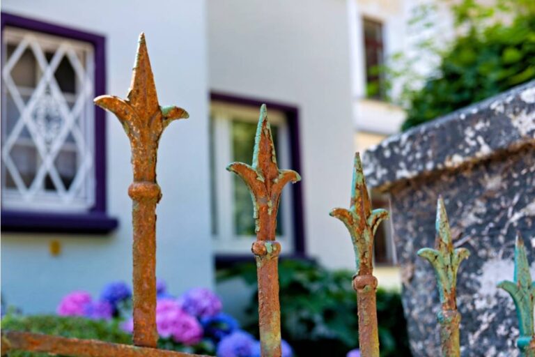 Everyone Assumed the Elderly Man on the Corner Just Liked an Unusual Fence Design, Until a Historian Recognized It as a Retired Railway Gate