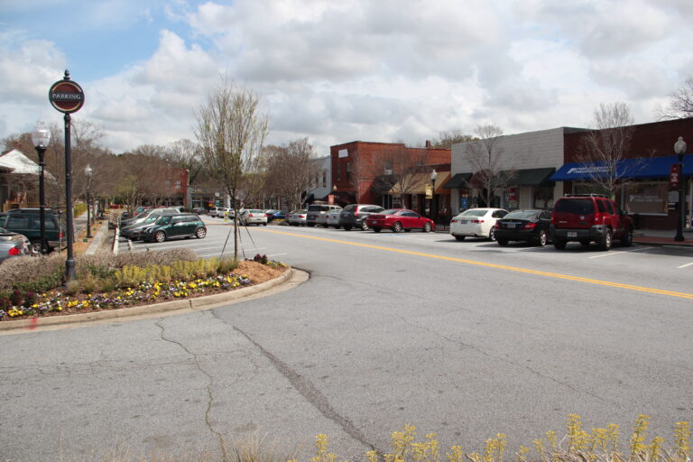 Downtown Norcross, Georgia, with shops and trees along the street
